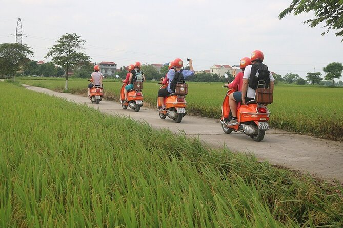 Beautiful Female Riders Vespa Red River Countryside Tour 5 Hours - Local people, markets, and the fruit farm stop