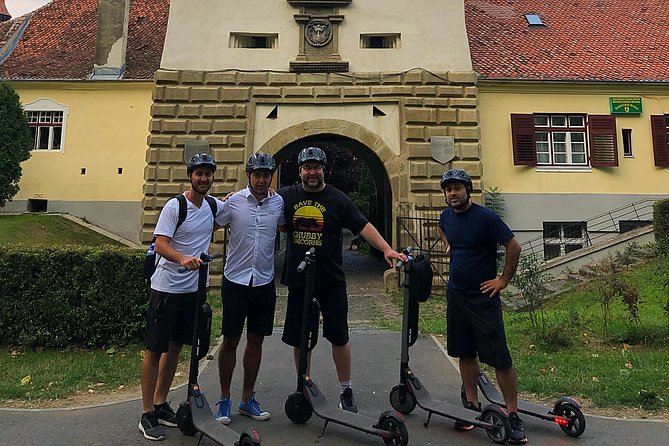 Brasov Old Town Guided Tour With Electric Scooters - The black and white towers above the old walls
