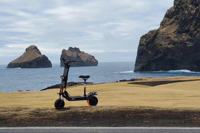 Eyjascooter volcano tour in Westman Island - Riding through town before the open views
