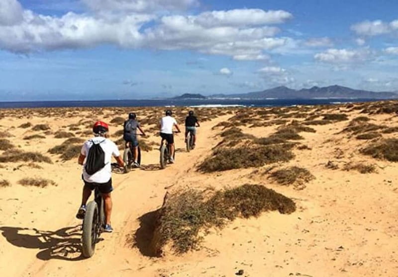 From Corralejo: Fuerteventura Guided E-Bike/E-scooter Tour - A drink stop near Lajares