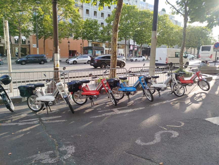 Guided tour of Paris on an electric Peugeot 103 moped - Starting at 148 Avenue des Champs-Élysées