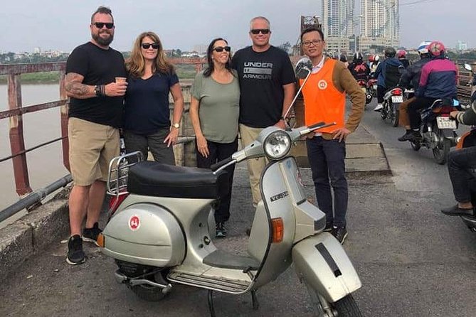 HANOI MUST SEE SITES Vespa Tour - Crossing Long Bien Bridge toward the Red River