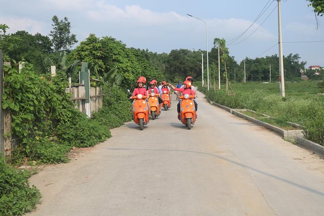 Hanoi Vespa Full Day City & Countryside with Female Ao Dai Riders - Railway life at Duong Tau
