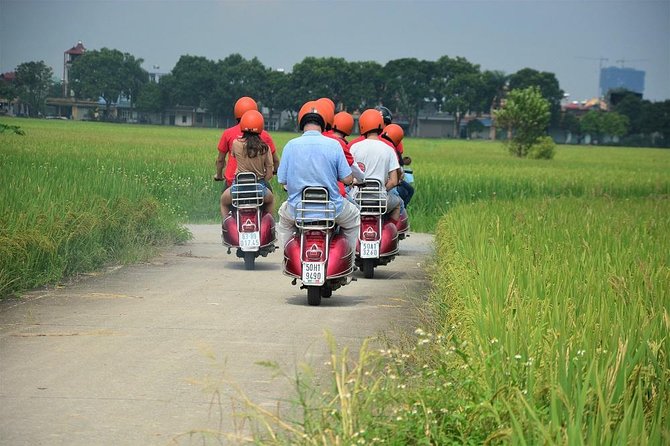 Hanoi Vespa Tours: Full Day Hanoi City & Countryside Vespa Tours - Crossing Long Bien Bridge toward the Red River