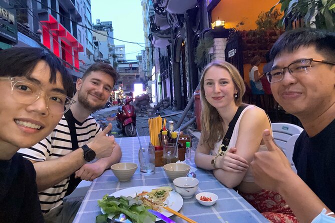 Ho Chi Minh City: Local Food Tour by Scooter with Vegan Option - Saigon’s oldest apartment complex after dark