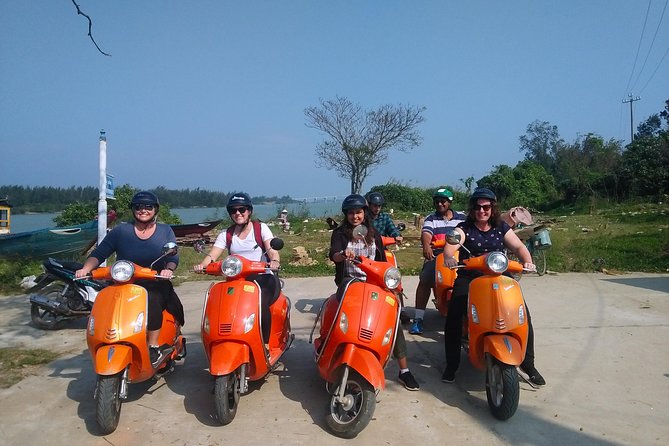 Hoi An Nightlife And Food Tour By Electric Scooter - Riding through old streets and along the riverfront