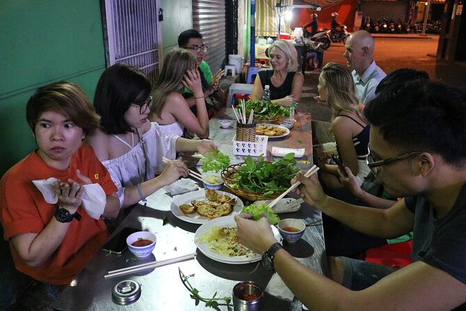 Hoi An Vespa By Night Street Food Tour - A riverside seafood stop with local atmosphere
