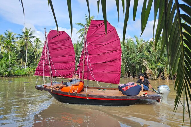Mekong Zigzag Full Day tour: Scooter, Sailboat, Food (HCM-BenTre) - Riding through Ben Tre by motorbike or tuk-tuk