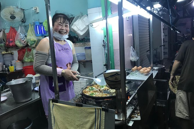 Private Saigon Night Food Tour by Scooter - Stop two: Choosing between beef and crab noodle soup