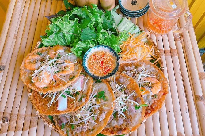 Saigon Scooter Adventure - City Sights & Street Food Tour - Ban Co Market and the city behind the main roads