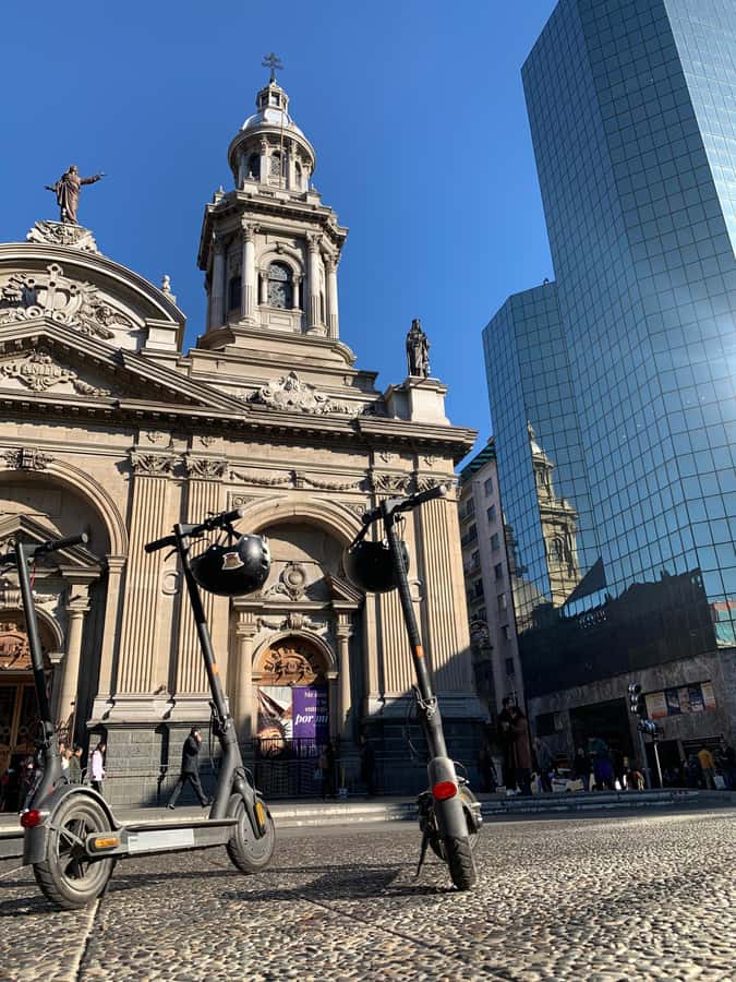 Santiago: Electric Scooter City Tour with Lunch - Riding the Alameda toward La Moneda