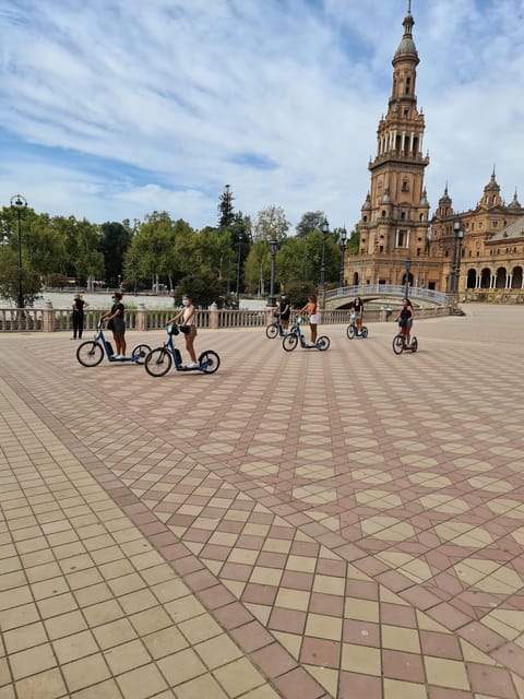 Seville: Electric Kickscooter Tour by night - Starting at the Seville Tourist Office