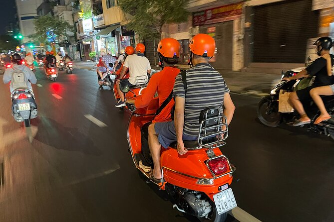 Vespa Female Ao Dai riders Night Street Food + See Train Street - Ngu Xa and Ho Truc Bach: the evening’s strongest food stop