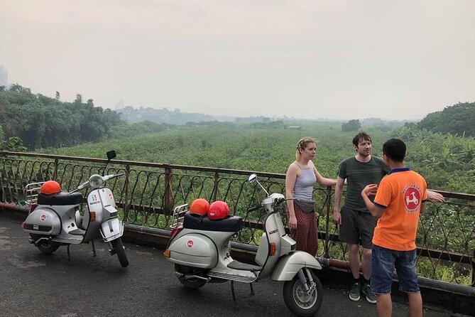 Vespa Tour HANOI BACK STREETS: FOOD+LOCAL LIFE+CULTURE & FUN - The mosaic wall, West Lake, and Ngoc Ha lanes